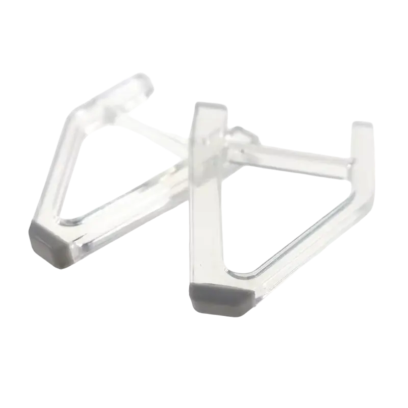 Pair of transparent triangular horizontal support feet with gray contact pads for a PS5 Slim console - THARAA STORE