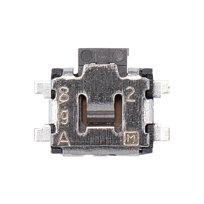 Small black and silver PS4 power and eject tactile switch shown from three angles, with metal mounting tabs and electrical contacts - THARAA STORE