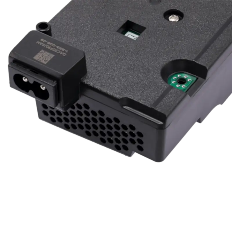 Black internal PS5 power supply unit for compatible CFI-10XX and CFI-11XX consoles, shown from multiple angles with its specification label, ventilation openings, mounting points and AC power connector - THARAA STORE