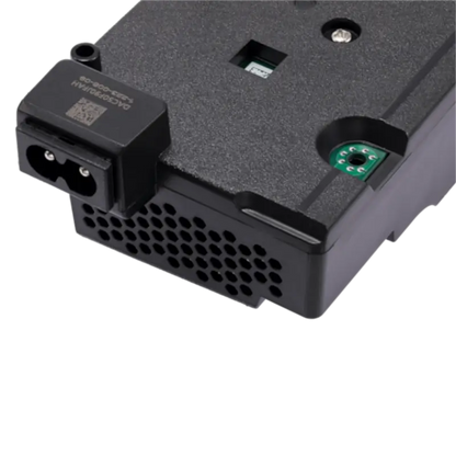Black internal PS5 power supply unit for compatible CFI-10XX and CFI-11XX consoles, shown from multiple angles with its specification label, ventilation openings, mounting points and AC power connector - THARAA STORE