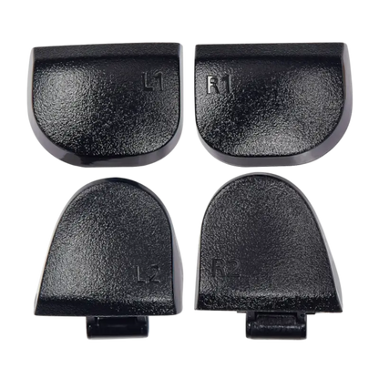 Four black PS5 DualSense replacement buttons labelled L1, R1, L2 and R2, shown from the front and rear with their mounting structures visible - THARAA STORE