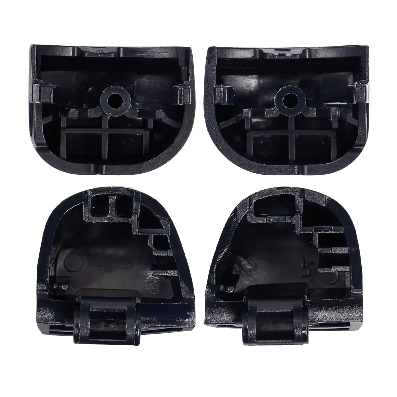 Four black PS5 DualSense replacement buttons labelled L1, R1, L2 and R2, shown from the front and rear with their mounting structures visible - THARAA STORE