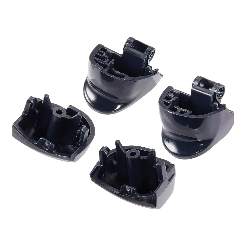 Four black PS5 DualSense replacement buttons labelled L1, R1, L2 and R2, shown from the front and rear with their mounting structures visible - THARAA STORE