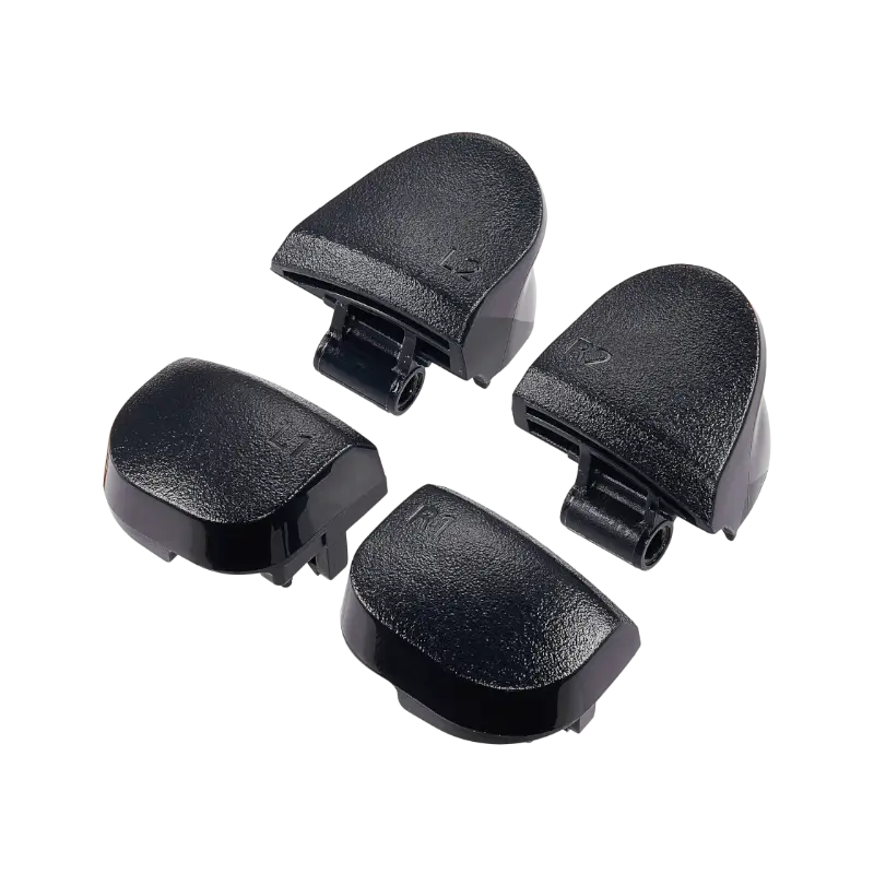 Four black PS5 DualSense replacement buttons labelled L1, R1, L2 and R2, shown from the front and rear with their mounting structures visible - THARAA STORE