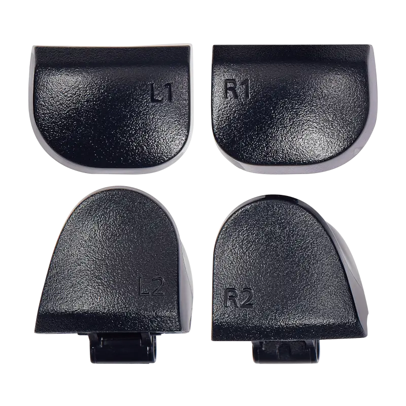  Four black PS5 DualSense replacement trigger buttons labelled L1, R1, L2 and R2, shown from the front and rear with their mounting structures visibl - THARAA STORE