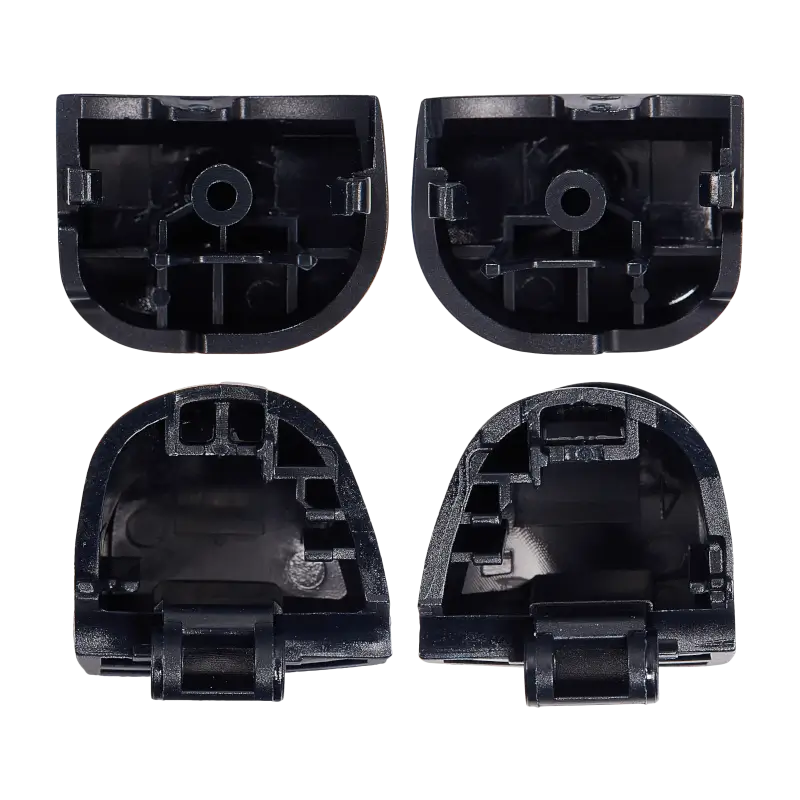  Four black PS5 DualSense replacement trigger buttons labelled L1, R1, L2 and R2, shown from the front and rear with their mounting structures visibl - THARAA STORE