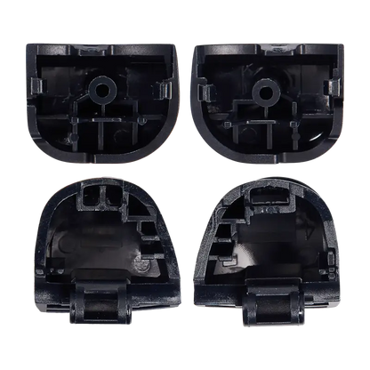  Four black PS5 DualSense replacement trigger buttons labelled L1, R1, L2 and R2, shown from the front and rear with their mounting structures visibl - THARAA STORE