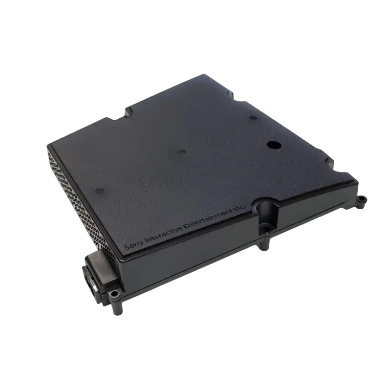 Black ADP-400JR internal power supply for a compatible PS5 Slim console, shown from multiple angles with ventilation holes, mounting points, and AC power inlet - THARAA STORE