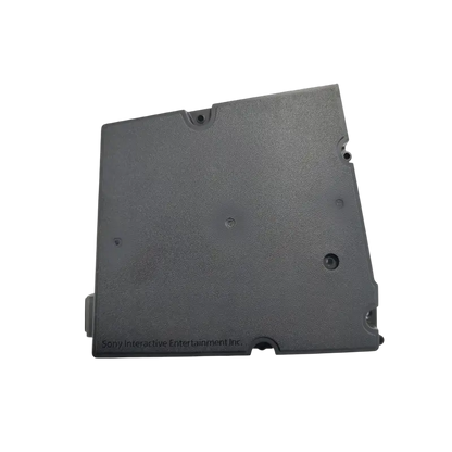 Black ADP-400JR internal power supply for a compatible PS5 Slim console, shown from multiple angles with ventilation holes, mounting points, and AC power inlet - THARAA STORE