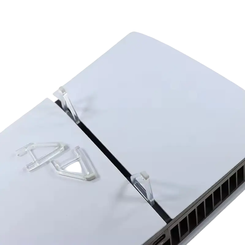 Pair of transparent triangular horizontal support feet with gray contact pads for a PS5 Slim console - THARAA STORE